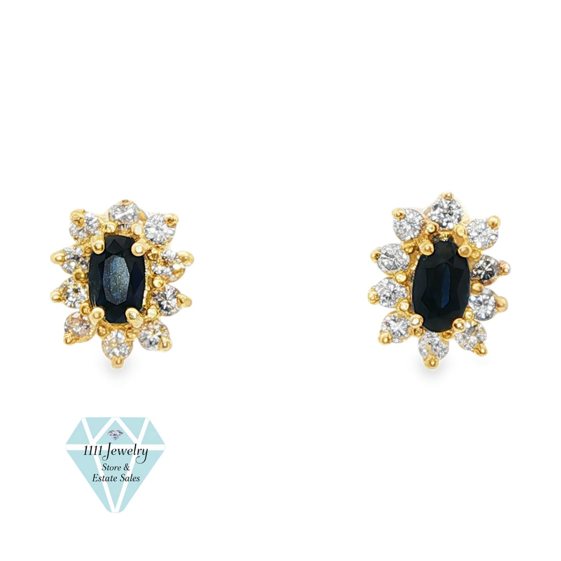 14K Gold.48 CTW Sapphire.20 CTW Diamond Halo Stud Earrings: Title: 14K Gold.48 CTW Sapphire.20 CTW Diamond Halo Stud Earrings Description: Pair of 14K yellow-gold halo stud earrings, each centered by an approximately 5 mm x 3 mm marquise-cut blue sapphire in a