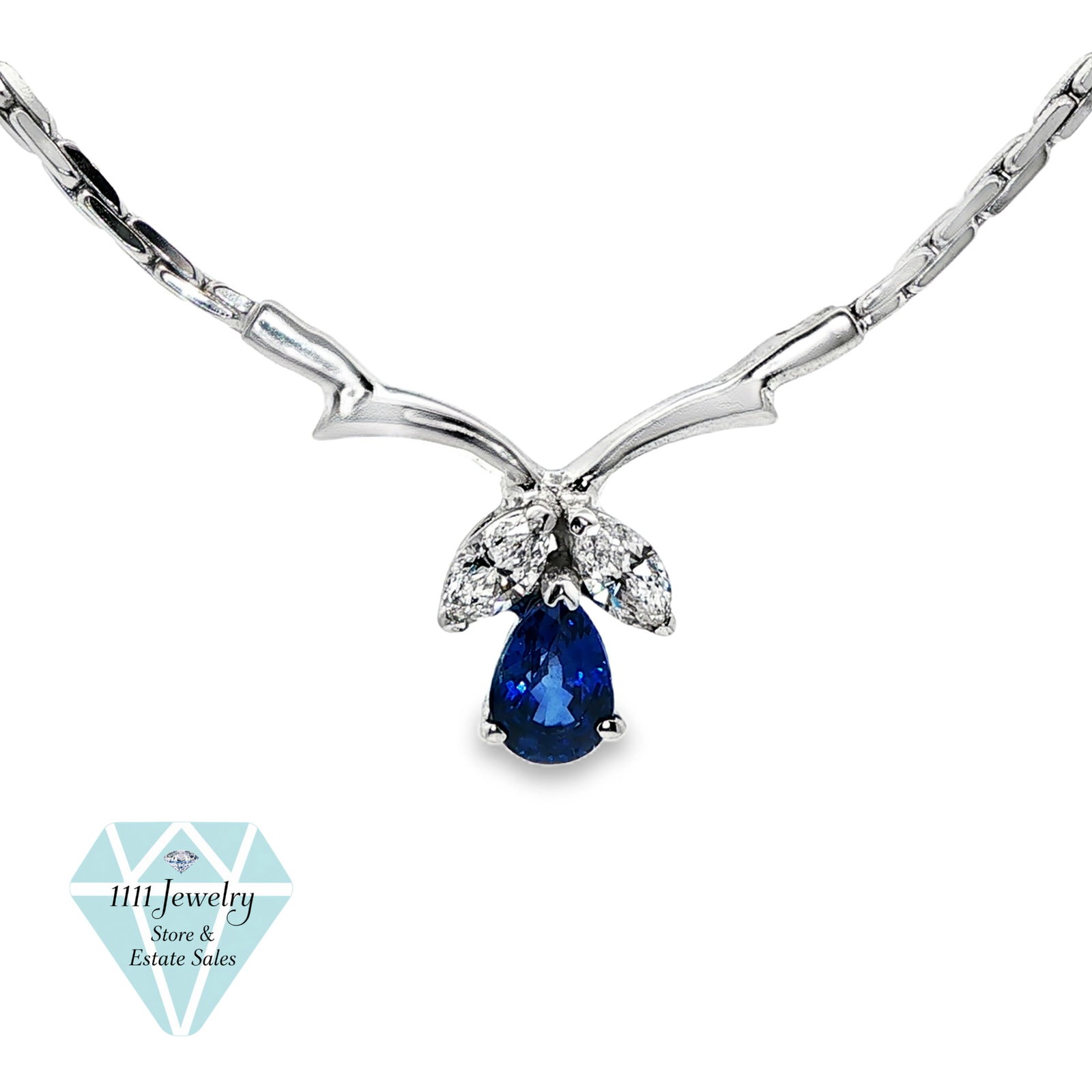 NEI 14K White Gold 0.57 CT Sapphire & 0.40 CTW Diamond Necklace: Title: NEI 14K White Gold 0.57 CT Sapphire & 0.40 CTW Diamond Necklace Description: Designer-signed NEI necklace crafted in 14K white gold with an articulated collar-style chain and fixed center drop.