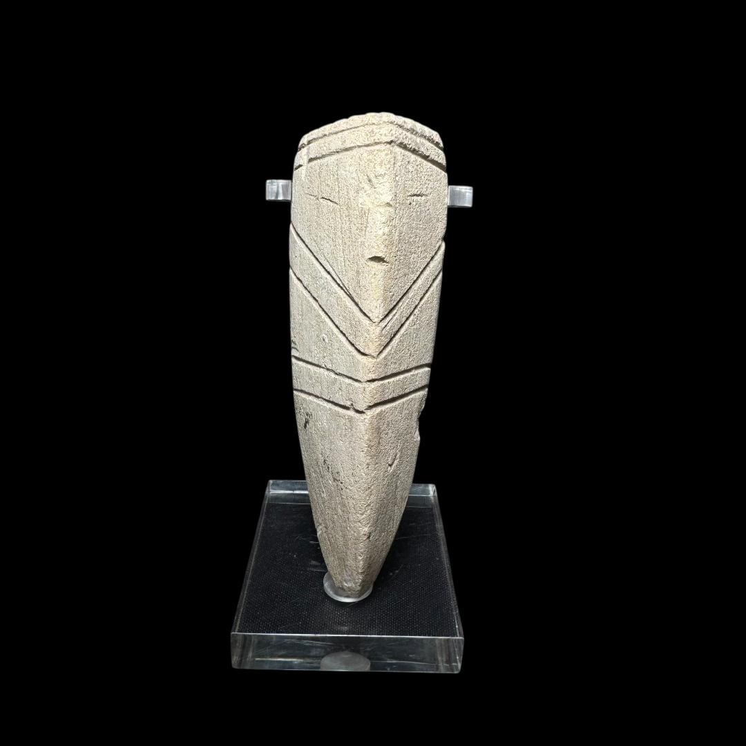Pre-Columbian Anthropomorphic "Tusk" Ritual Figure (Chorrera tradition): Pre-Columbian Anthropomorphic Ritual Figure (Chorrera tradition)Engoroy Culture, Coastal EcuadorLate Formative Period, circa 600–100 BC. A finely carved anthropomorphic stone figure from the Engoroy
