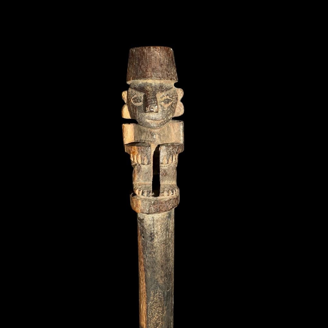 Pre-Columbian Chimú Wooden Staff with Anthropomorphic Finial: Chimú Wooden Staff with Anthropomorphic FinialPre-Columbian, North Coast Peru, ca. 1100–1450 CEWood, 59 in (150 cm) in lengthFinely carved from a single piece of dense hardwood, this ceremonial sta