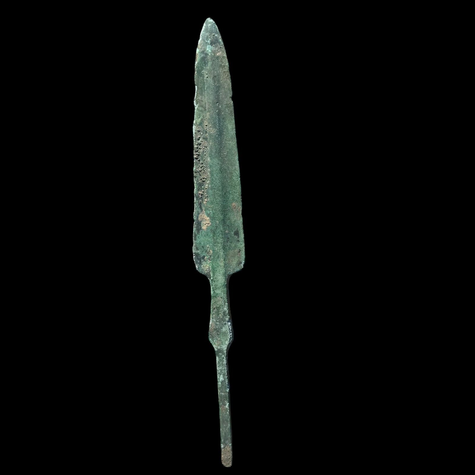 Ancient Luristan Bronze Leaf-Bladed Spearhead: Ancient bronze spearhead from the Luristan region of western Iran, featuring a long leaf-shaped blade and narrow tang, commonly referred to as the “rat tail” type. This elegant form is charact