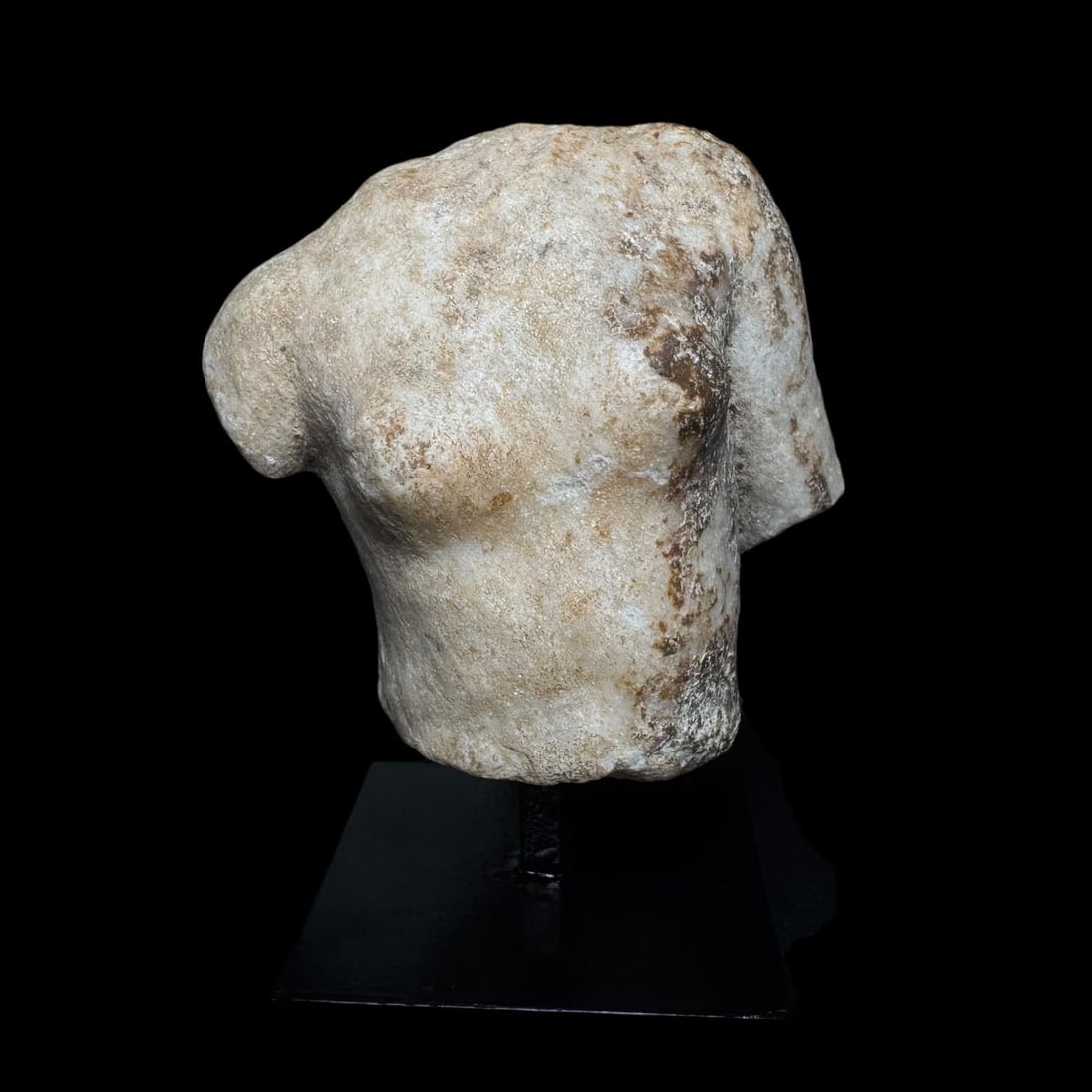 Ancient Roman Alabaster Torso Fragment: A finely carved alabaster torso fragment from the Roman Imperial period, dating to approximately the 1st–3rd century AD. This sculpture was once part of a larger statue, likely depicting a deity, he