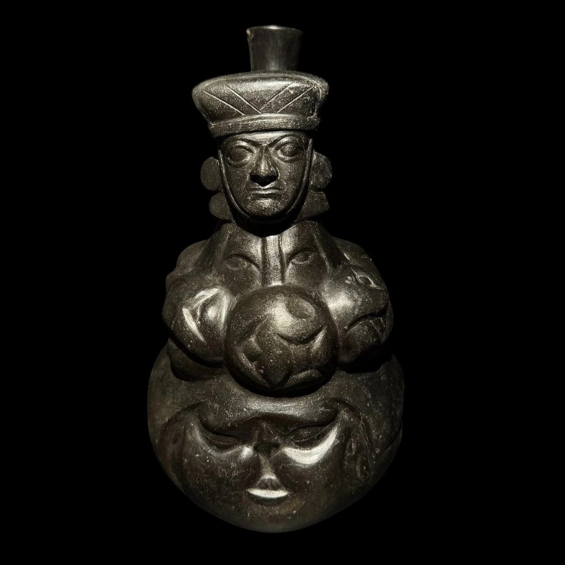 Pre-Columbian Moche Pottery Vessel Reproduction: Pre-Columbian Moche Stirrup Spout Vessel Reproduction – Portrait Figure with Multi-Face Design. A fine reproduction of a Pre-Columbian Moche stirrup-spout vessel, inspired by original examples from