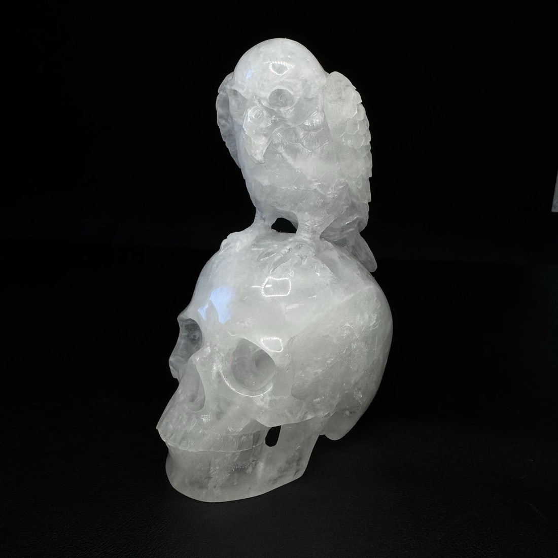 Crystal Carved Skull With Bird - Clear Quartz: Crystal Carved Skull with Bird – 6 1/2” – Clear Quartz – Hand-Carved – Repaired Beak Beautiful hand-carved crystal sculpture featuring a detailed human skull with a perched bird above. C