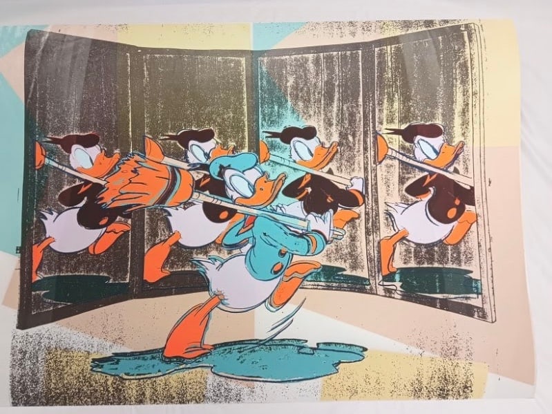 Andy Warhol "Anniversary Donald Duck, 1985" sold after: Andy Warhol "Anniversary Donald Duck, 1985" on Arches 88 paper. Measures approx. 30.5x43. These are part of the estate sale and we do not have a COA. This Lithograph does not carry established documen