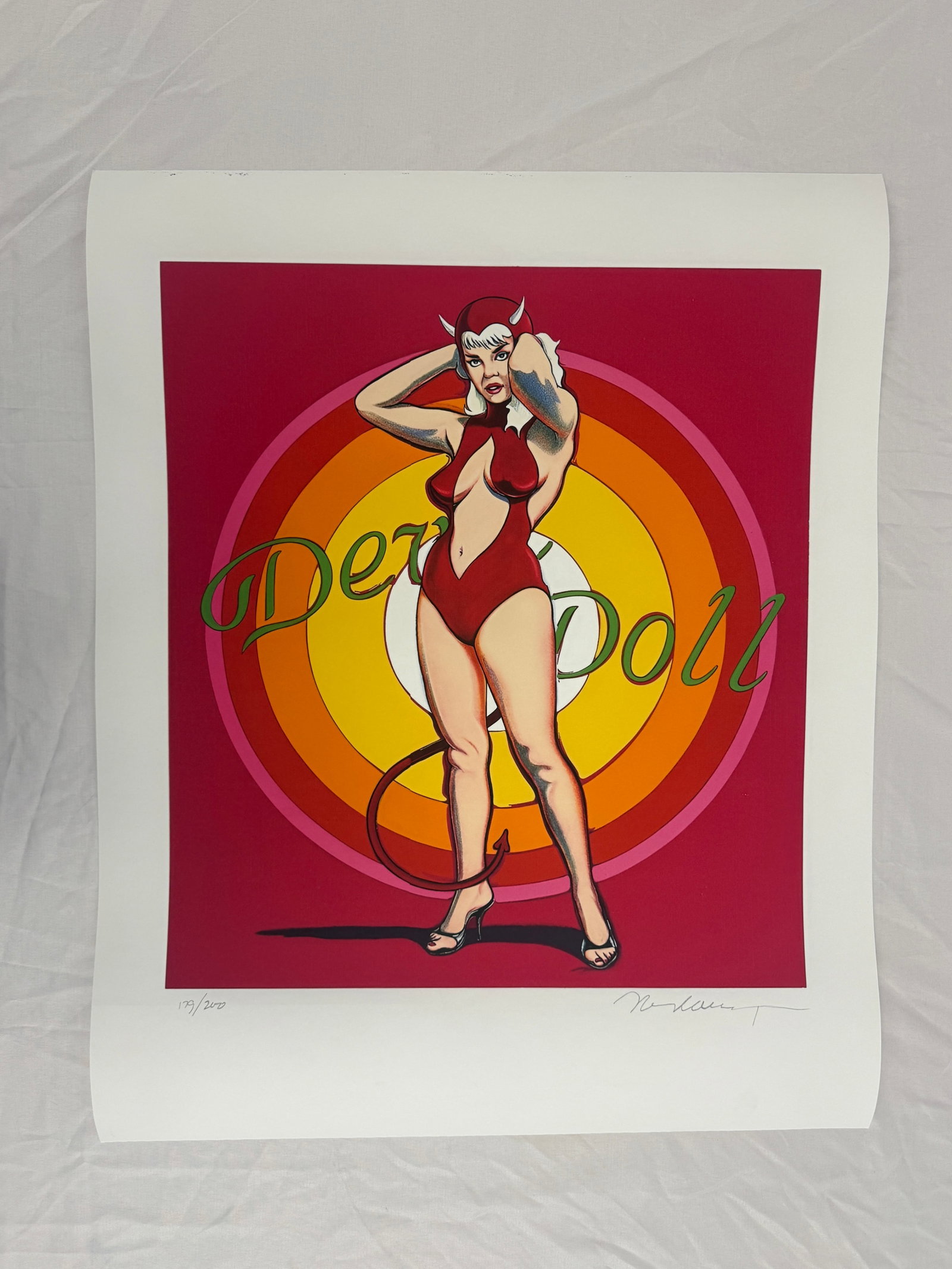 Mel Ramos "Devil Doll (1997)" Print sold after: Mel Ramos "Devil Doll" Print on hevay wove fine art paper. Sold after. measures 28.7x22.4 inches. These are part of the estate sale and we do not have a COA. All lots offered in our auctions are sold 