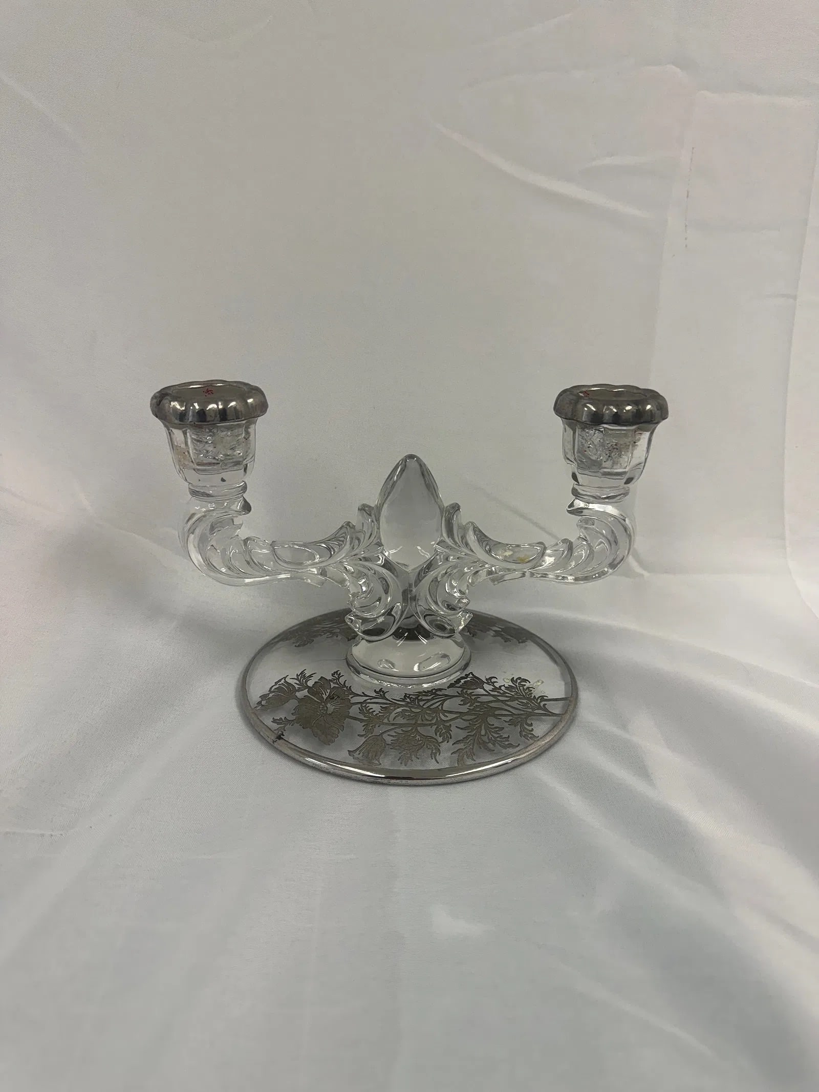 Vintage New Martinsville glass double candlestick holder: Vintage New Martinsville glass double candlestick holder These are part of the estate sale and we do not have a COA. All lots offered in our auctions are sold strictly on an "AS IS" basis. Any descrip