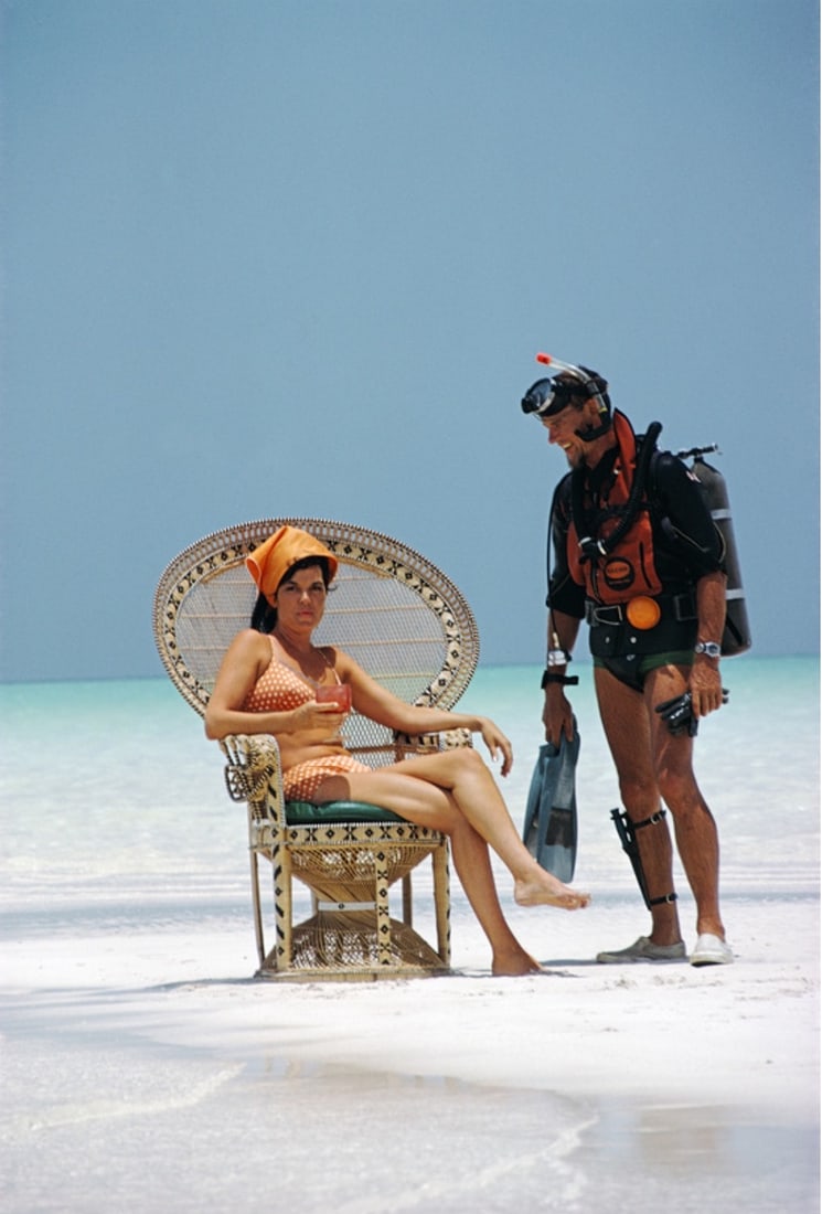 Slim Aarons 'A Friendly Chat' After: A Friendly Chat' Photo print by Slim Aarons, after. Printed on Kodak photo paper. Measures 16x20 inches. These are part of the estate sale and we do not have a COA. All lots offered in our auctions