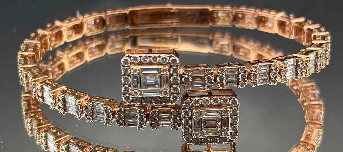 14K ROSE GOLD BAGUETTE DIAMOND BANGLE BRACELET 5.94CT: 14K rose gold bangle bracelet featuring 5.94ct baguette and round brilliant cut earth-mined diamonds, G-H color, VS1/VS2 clarity. Secure clasp closure. Total gold weight 18.2 grams. All stones secure,