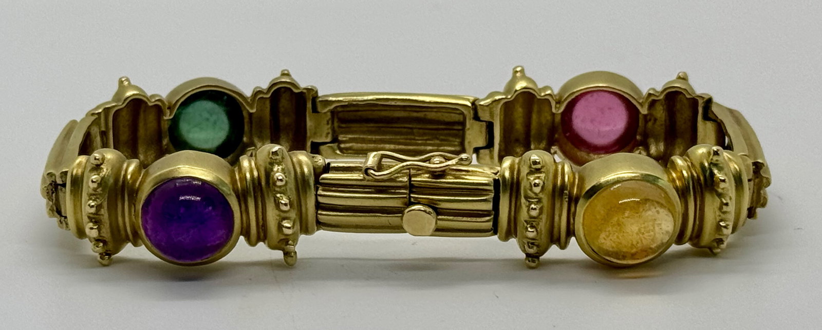 Antique 14k Yellow Gold Multi-Gemstone Cabochon Bracelet | 28.5g: This elegant 14k yellow gold bracelet features four vibrant, hand-selected gemstones: Amethyst, Citrine, and Green and Pink Tourmalines. Each natural gemstone is meticulously cut in a smooth cabochon 