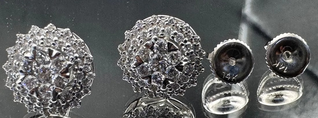 14K WHITE GOLD DIAMOND CLUSTER STUD EARRINGS 1.20CT: 14K white gold diamond cluster stud earrings featuring 1.20ct round brilliant cut earth-mined diamonds, G color, VS1 clarity, invisible set. 40 diamonds per earring. Screw-back closure. Total weight 2