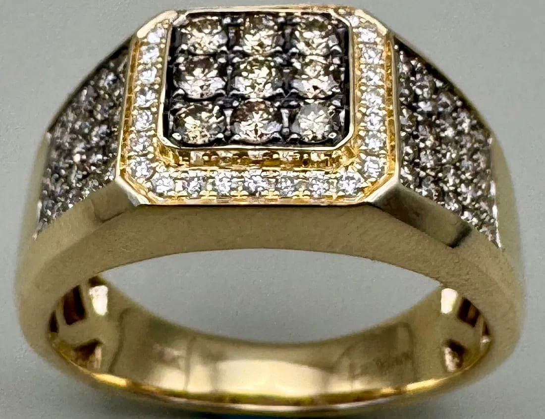 14K YELLOW GOLD CHOCOLATE DIAMOND CLUSTER RING 1.20CT: 14K yellow gold ring featuring 1.20ct round brilliant cut earth-mined diamonds, cluster of chocolate diamonds in center and sides, set in prong and pave setting. Accent white diamonds F-G color, VS cl