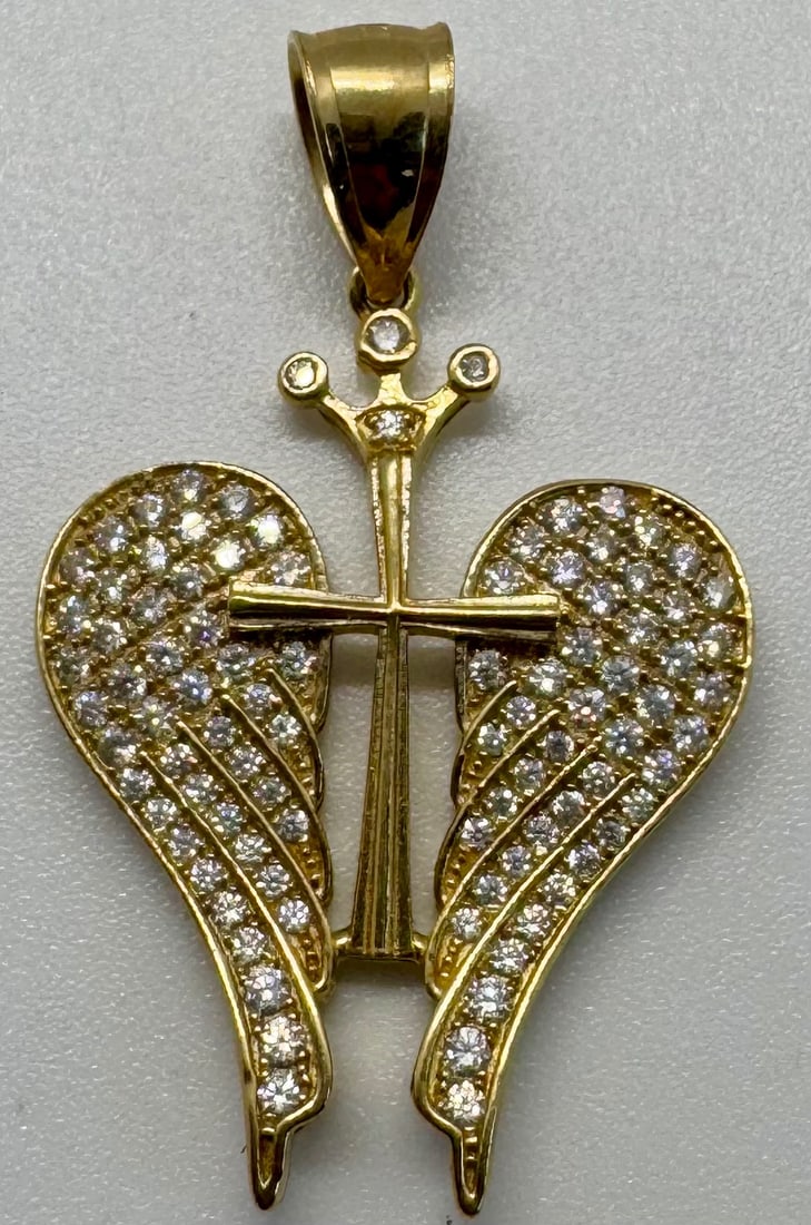 10K YELLOW GOLD & CUBIC ZIRCONIA INTRICATE PENDANT (3.0G): This exquisite yellow gold pendant is masterfully crafted in 10K gold, featuring a beautifully intricate design accented with brilliant cubic zirconia stones. Measuring a significant 1.4 inches in len