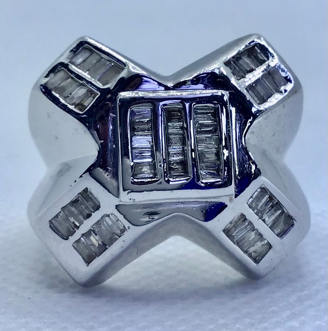 14k White Gold 1.50ctw Invisible-Set Baguette Diamond "X" Shape Ring (20g): This unique and impressive "X" shaped men’s ring is a masterclass in modern geometric design. Expertly handcrafted in solid 14k white gold, the ring showcases 1.50 carats of 100% natural baguette di