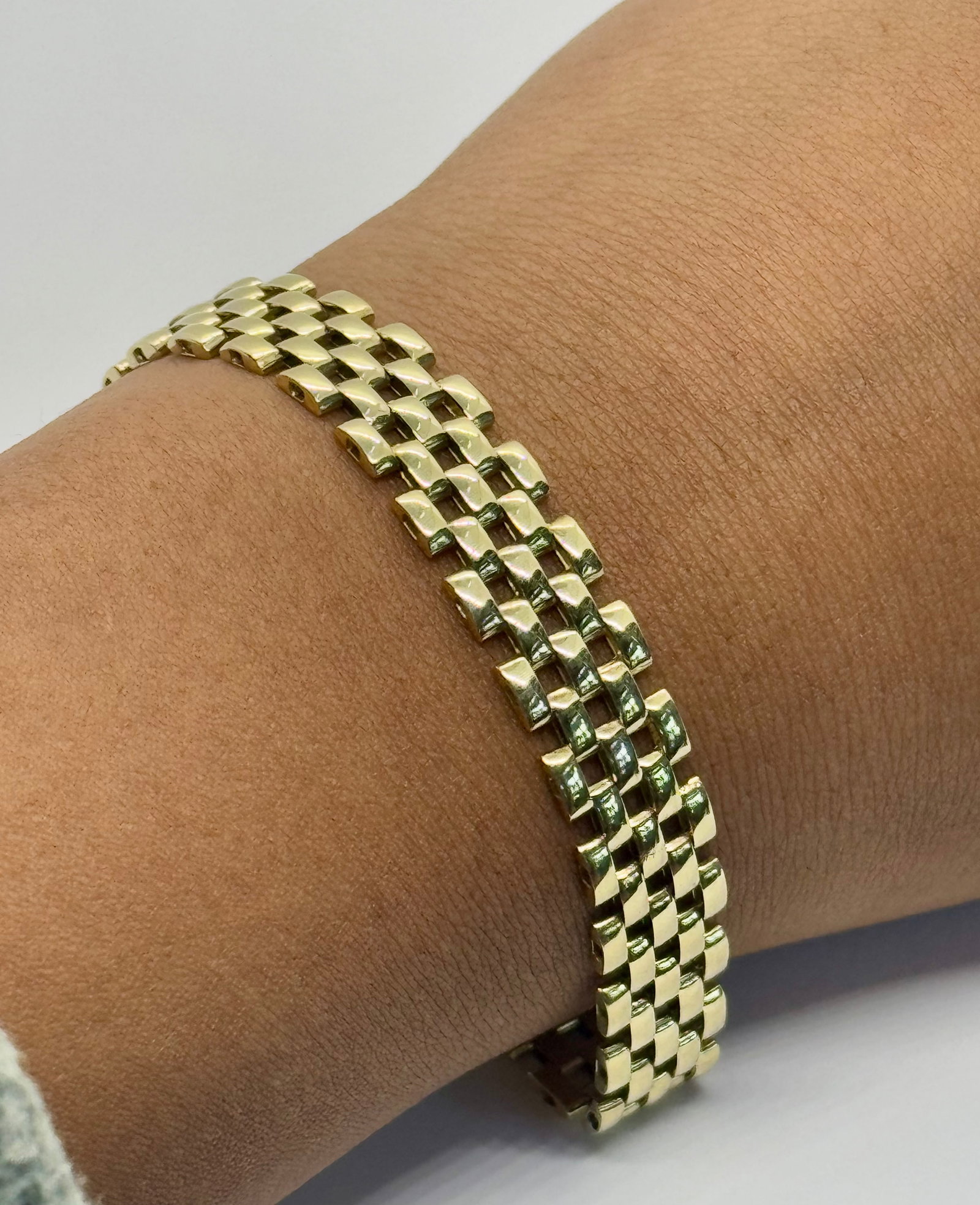 14k Yellow Gold Italian Panther Link Bracelet | 10mm Wide: This exquisite 14k yellow gold bracelet features the iconic "Panther" link—a series of high-polish, interconnected brick-style links that provide a smooth, liquid-like drape on the wrist. Measuring 