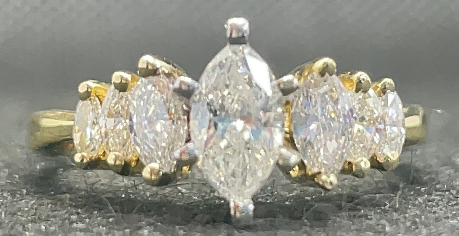 14k Two-Tone Gold 1.10ctw Marquise Diamond 6-Stone Ring (3.3g): This dainty and romantic ring features a curated selection of marquise-cut diamonds in a sophisticated 6-side stone arrangement. The design showcases 1.10 carats total weight of 100% earth-mined marqu