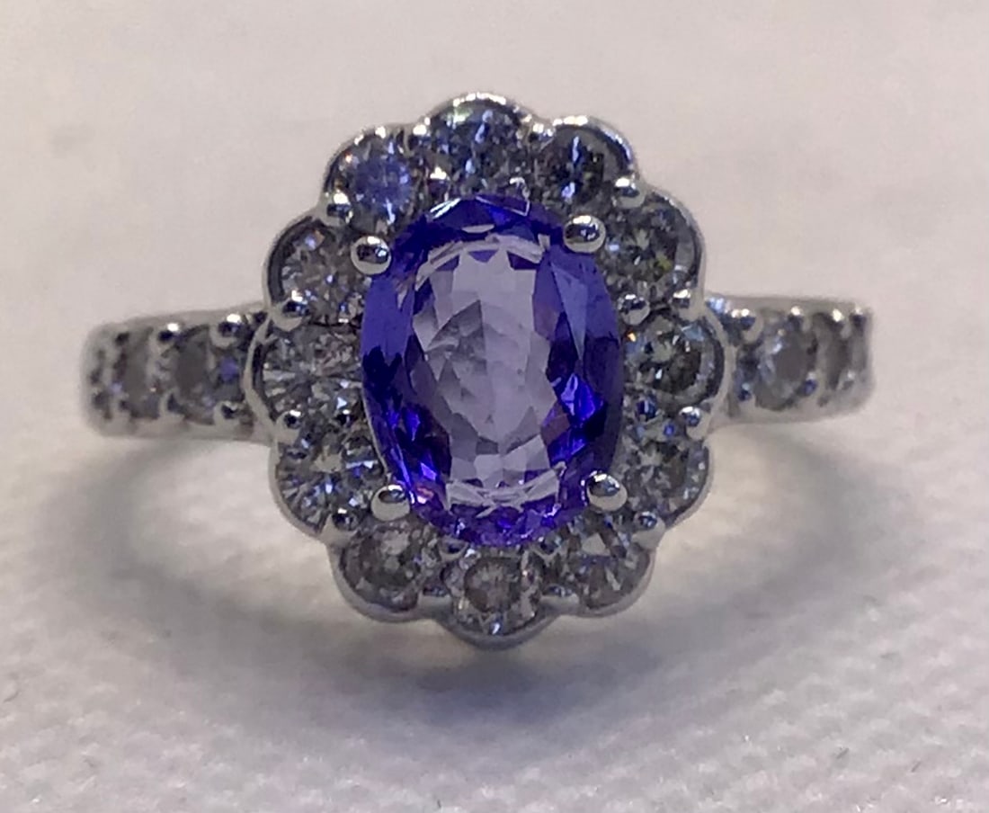 Solid Platinum 1.50ct Oval-Cut Blue Tanzanite & 1.00ctw Diamond Halo Ring (6.5g): This unique and high-end ring delivers standout style with the prestigious weight of solid platinum and captivating color. The centerpiece features a brilliant 1.50-carat genuine oval-cut blue tanzani