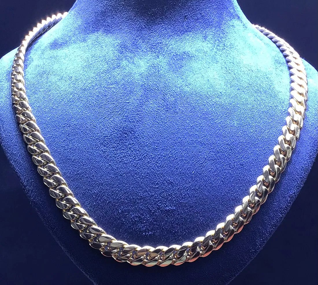 14K YELLOW GOLD SOLID CUBAN LINK CHAIN NECKLACE 26 INCH 106.4G: 14K yellow gold solid Cuban link chain necklace, 26 inches long, 7mm wide. Double hinged box clasp closure. Total weight 106.4 grams. Stamped 14K. New condition. Please review all photos carefully bef