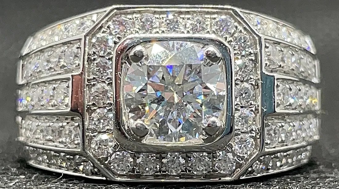 18K WHITE GOLD 2.20CTW LAB GROWN OCTAGON RING: Luxurious 18K white gold statement ring featuring a 1.15 carat round brilliant cut lab-grown diamond center stone set within a unique octagon-shaped head. The center stone is complemented by 1.05 cara