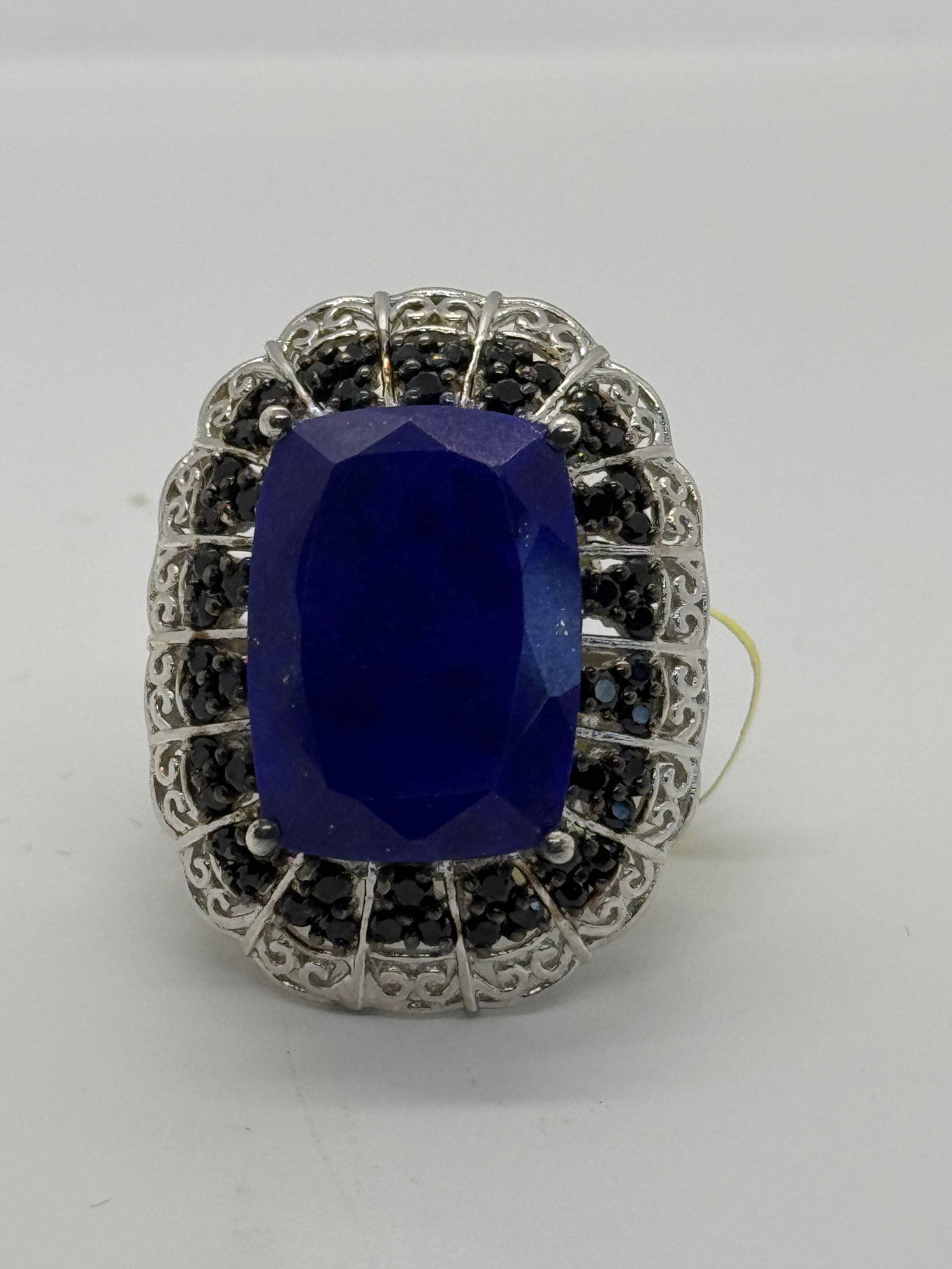 STERLING SILVER & LAPIS LAZULI SOLITAIRE RING (10.3G): This exquisite sterling silver ring features a stunning lapis lazuli stone, known for its deep, rich sapphire-like hue and natural golden pyrite inclusions. The stone is expertly set in a bright, high
