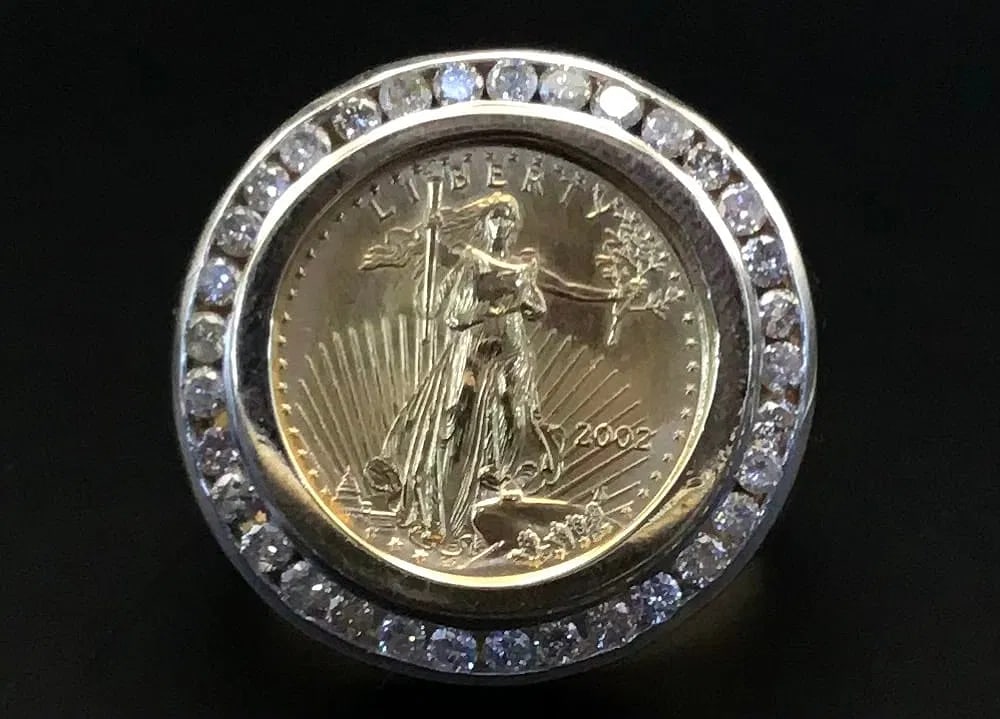 14K GOLD LIBERTY COIN DIAMOND RING 22K COIN 1.00CT DIAMOND: 14K gold ring featuring a 22K yellow gold Liberty coin center piece adorned with 1.00ct round brilliant cut earth-mined diamonds, G color, SI1 clarity. Coin weight 2.8 grams, ring weight 11.8 grams, t