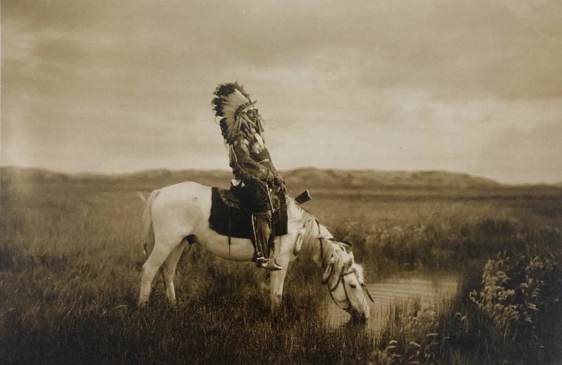 EDWARD CURTIS (1868-1952): An Oasis in the Bad Lands, Printed in colors mounted on archival board 8" x 12 3/4"