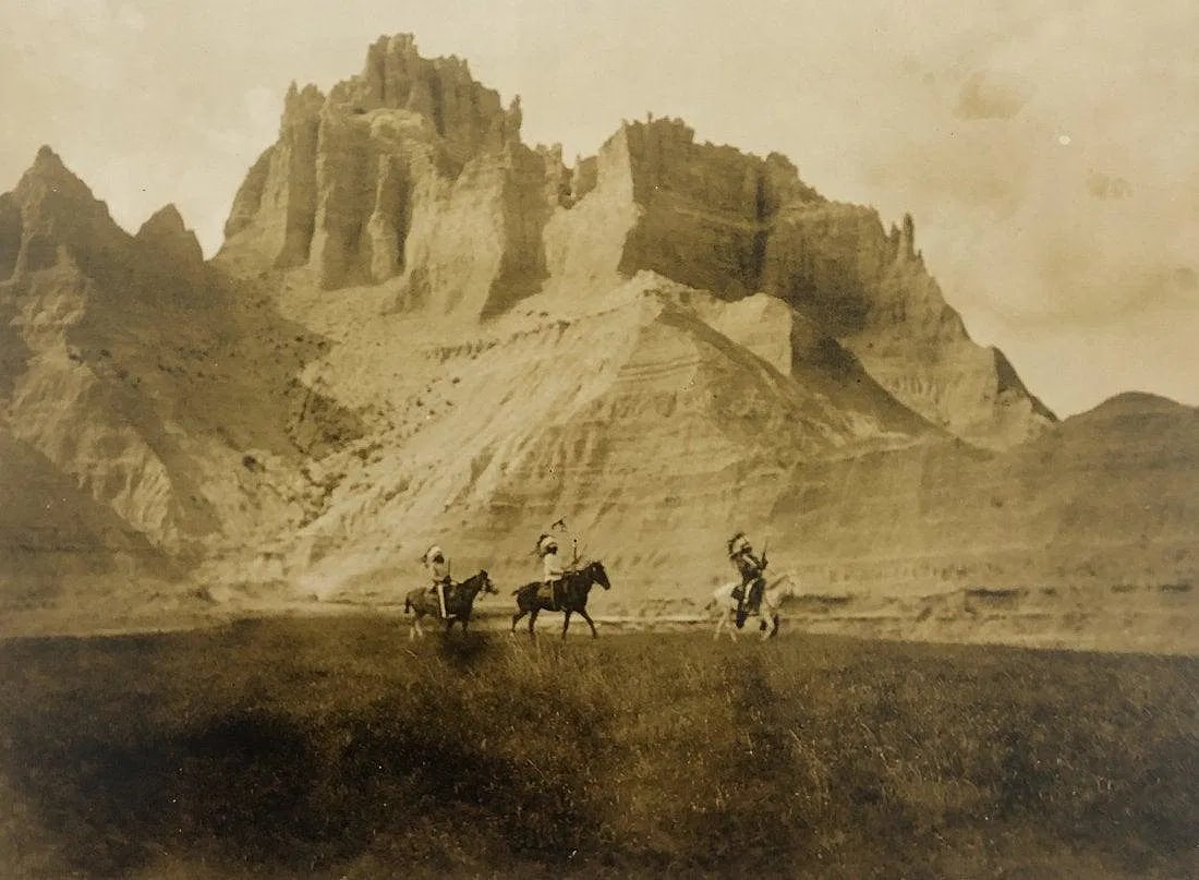 EDWARD CURTIS (1868-1952): Entering the Bad Lands, Sioux Printed in colors mounted on archival board 8" x 10 3/4"