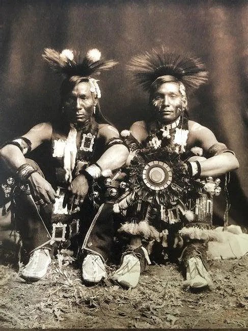 EDWARD CURTIS (1868-1952): The Boy & Short Man- Gros Ventre Printed in colors mounted on archival board 8 1/2" x 7"