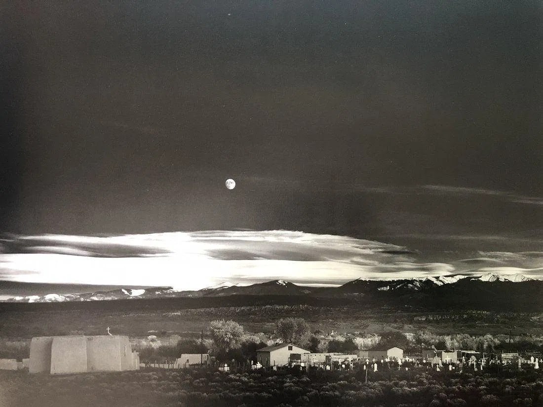 ANSEL ADAMS (B. 1902-1984): Moonrise, Hernandez New MexicoPrinted in colors mounted on archival board 11 1/2" x 15 1/4"