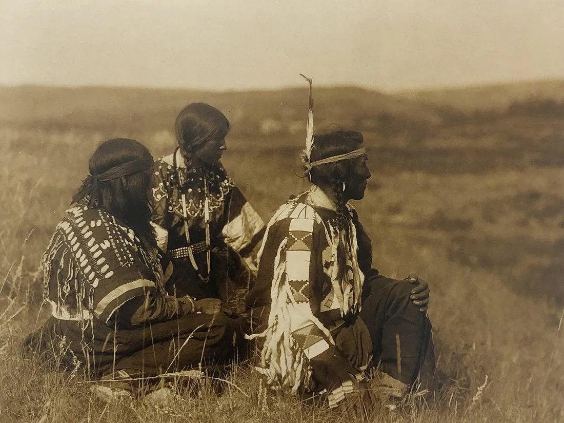 EDWARD CURTIS (1868-1952): Over looking the Piegan Camp Printed in colors mounted on archival board 8" x 10 3/4"