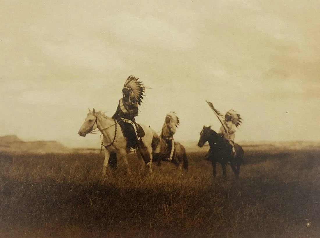 EDWARD CURTIS (1868-1952): The March of the Sioux Printed in colors mounted on archival board 8" x 10 1/2"