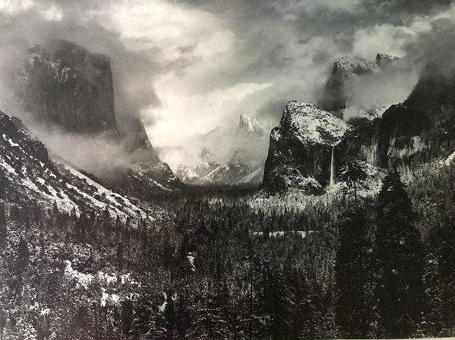 ANSEL ADAMS (B. 1902-1984): Yosemite Valley Thunderstorm Printed in colors mounted on archival board 7 1/2" x 9 1/2"