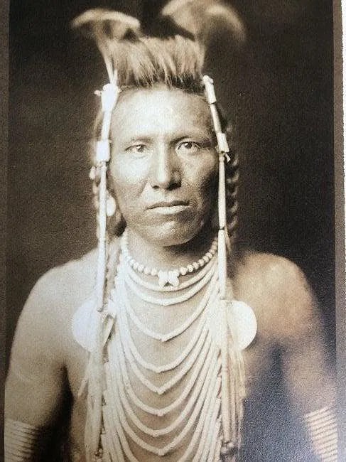 EDWARD CURTIS (1868-1952): Ben Long Ear Printed in colors mounted on archival board 8 1/2" x 5 1/2"
