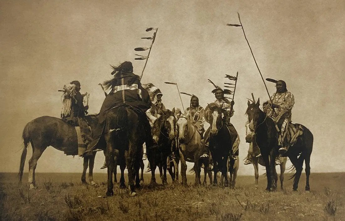 EDWARD CURTIS (1868-1952): Chiefs on Horseback Printed in colors mounted on archival board 12" x 8"