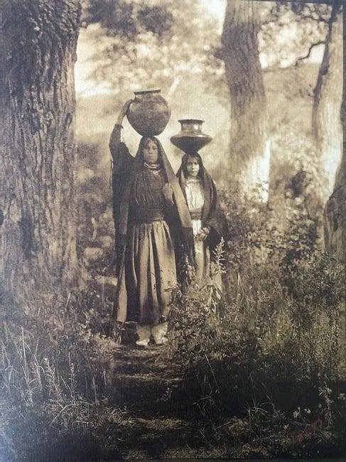 EDWARD CURTIS (1868-1952): Taos Water Carriers, Printed in colors mounted on archival board 9" x 6 1/2"