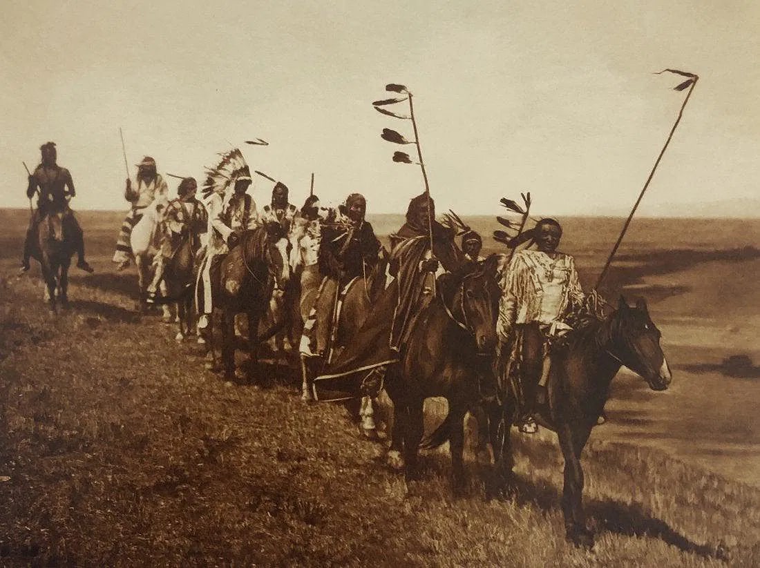 EDWARD CURTIS (1868-1952): On the Warpath Atsina Printed in colors mounted on archival board 8" x 10 3/4"