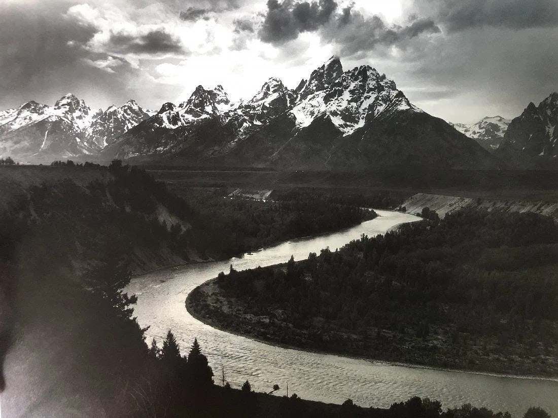 ANSEL ADAMS (B. 1902-1984): The Tetons and the Snake River, Grand Teton National Park, Wyoming Printed in colors mounted on archival board 11 1/2" x 15"