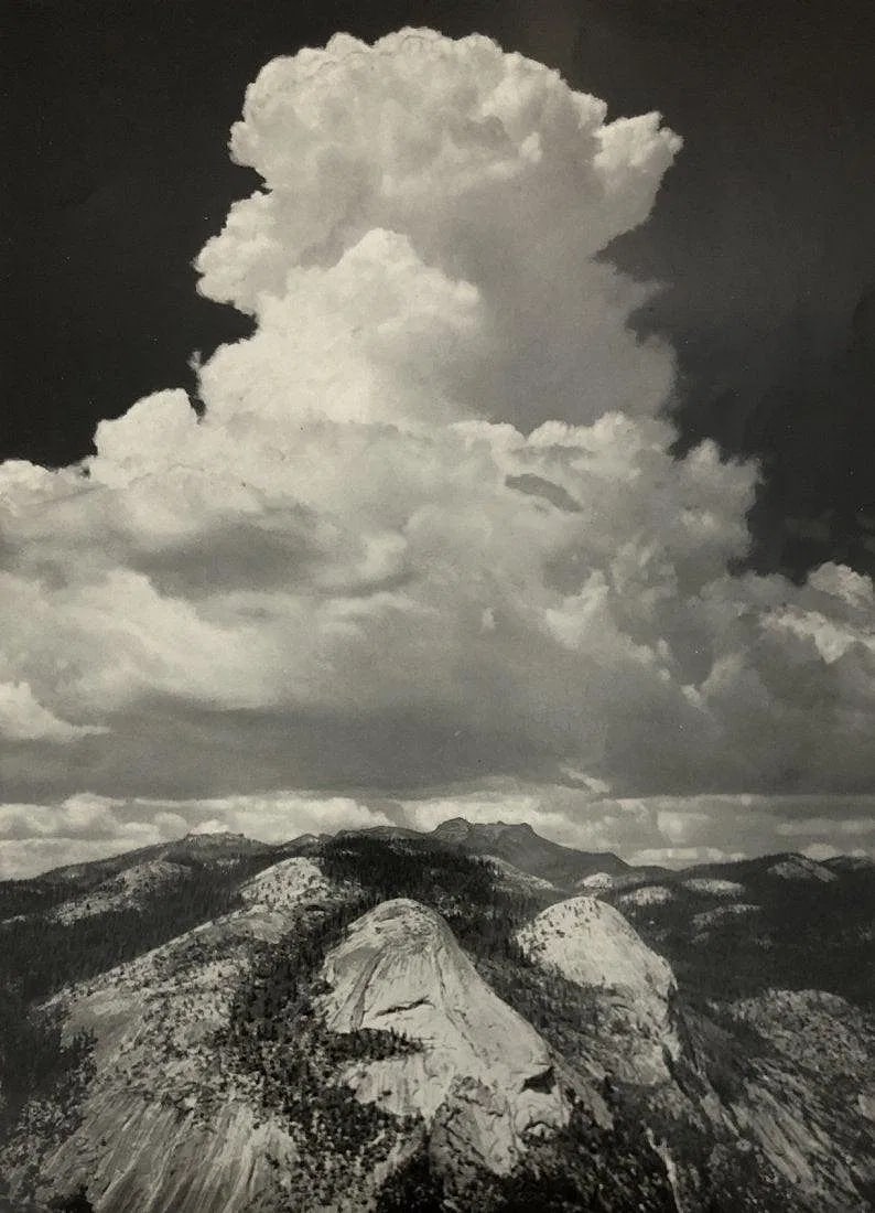 ANSEL ADAMS (B. 1902-1984): Thunderhead Glacier Point Printed in colors mounted on archival board 9 1/2" x 7"