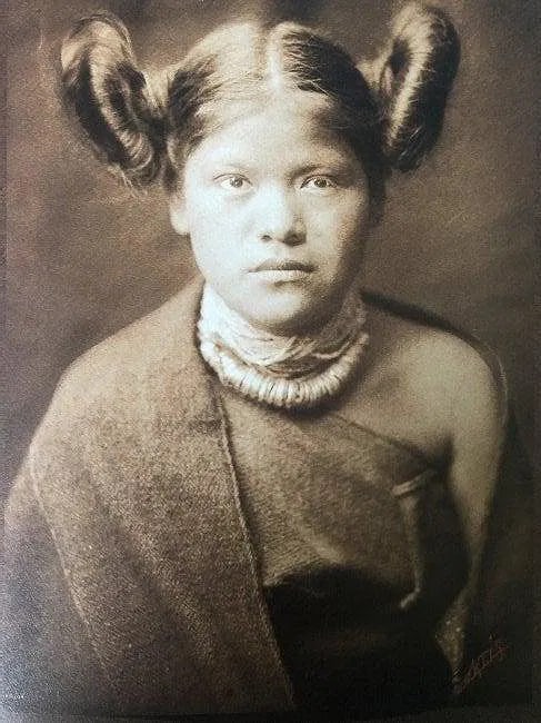 EDWARD CURTIS (1868-1952): A Hopi Girl Printed in colors mounted on archival board 8 1/2" x 6"