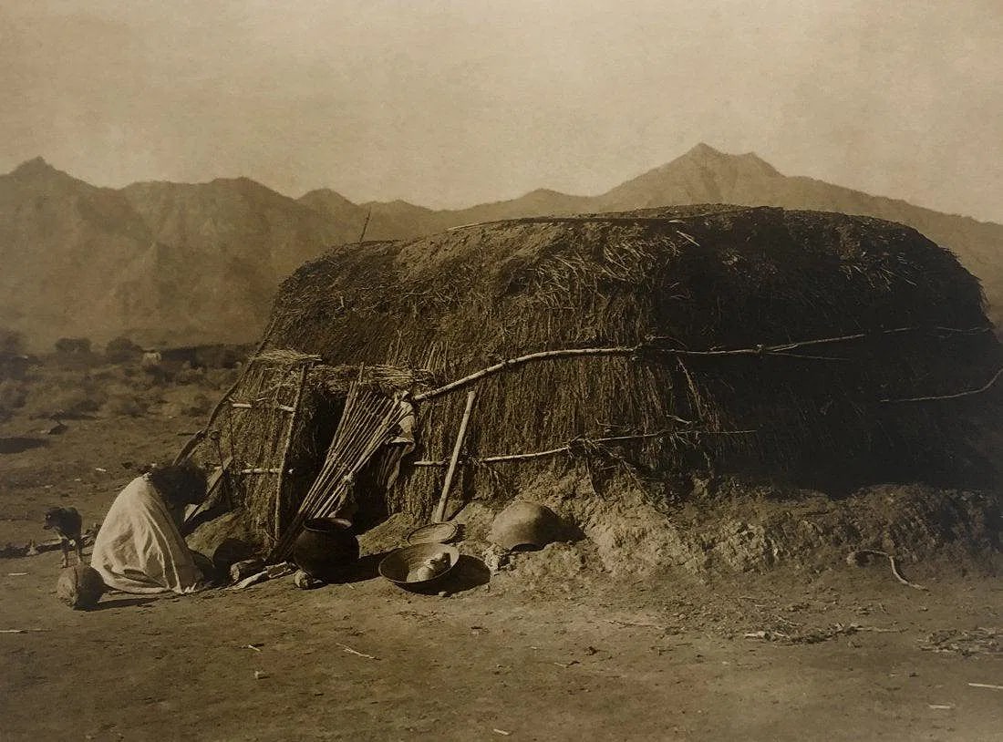 EDWARD CURTIS (1868-1952): Pima Earth Lodge Printed in colors mounted on archival board 8" x 10 3/4"