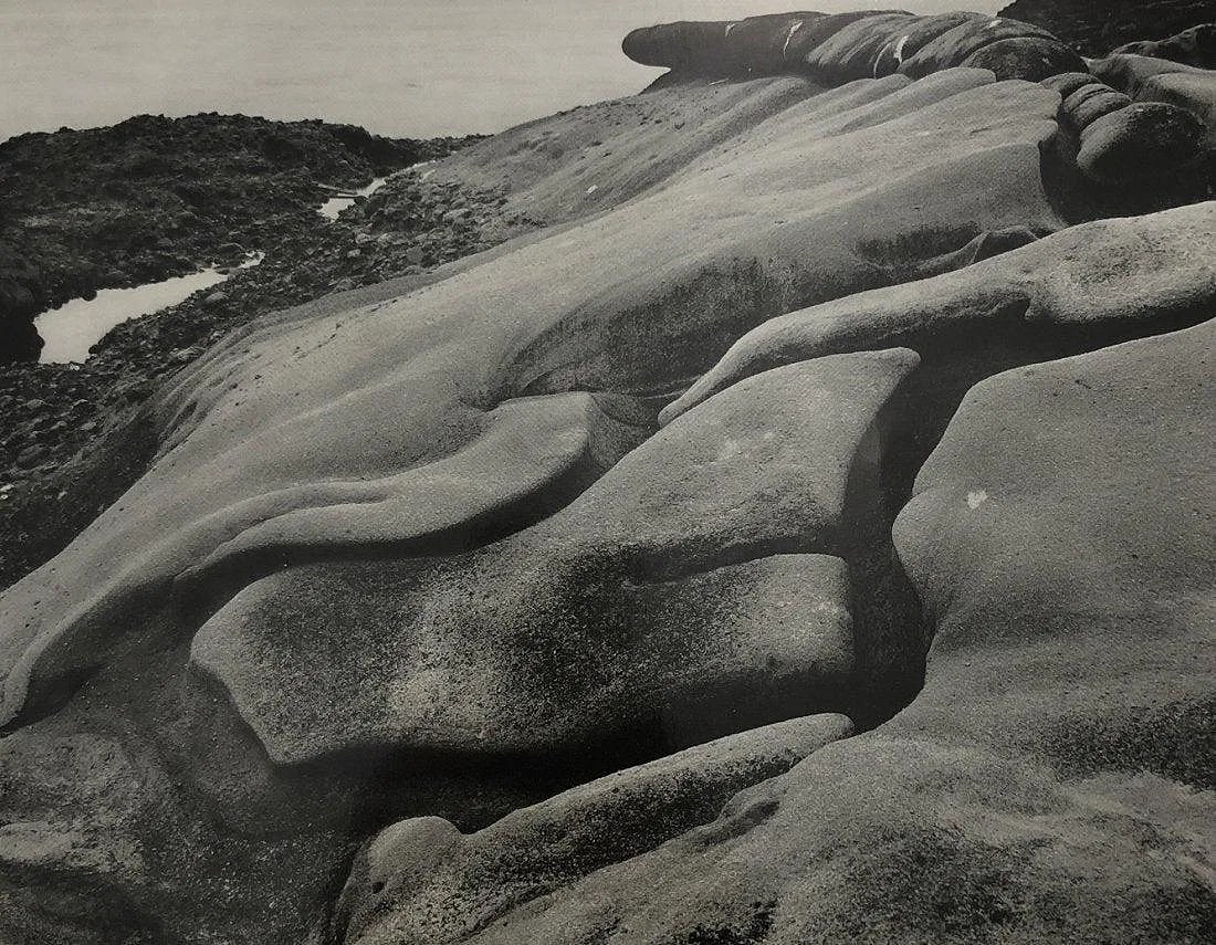 EDWARD WESTON (1886-1958): Eroded Rock Printed in colors mounted on archival board 7 1/2" x 9 1/2"