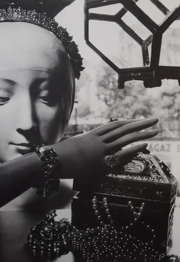 MAN RAY (1890-1976): Advertisement for Harpers Bazaar, (Head & Jewelry) Printed in colors mounted on archival board 10 3/8" x 7 3/8"