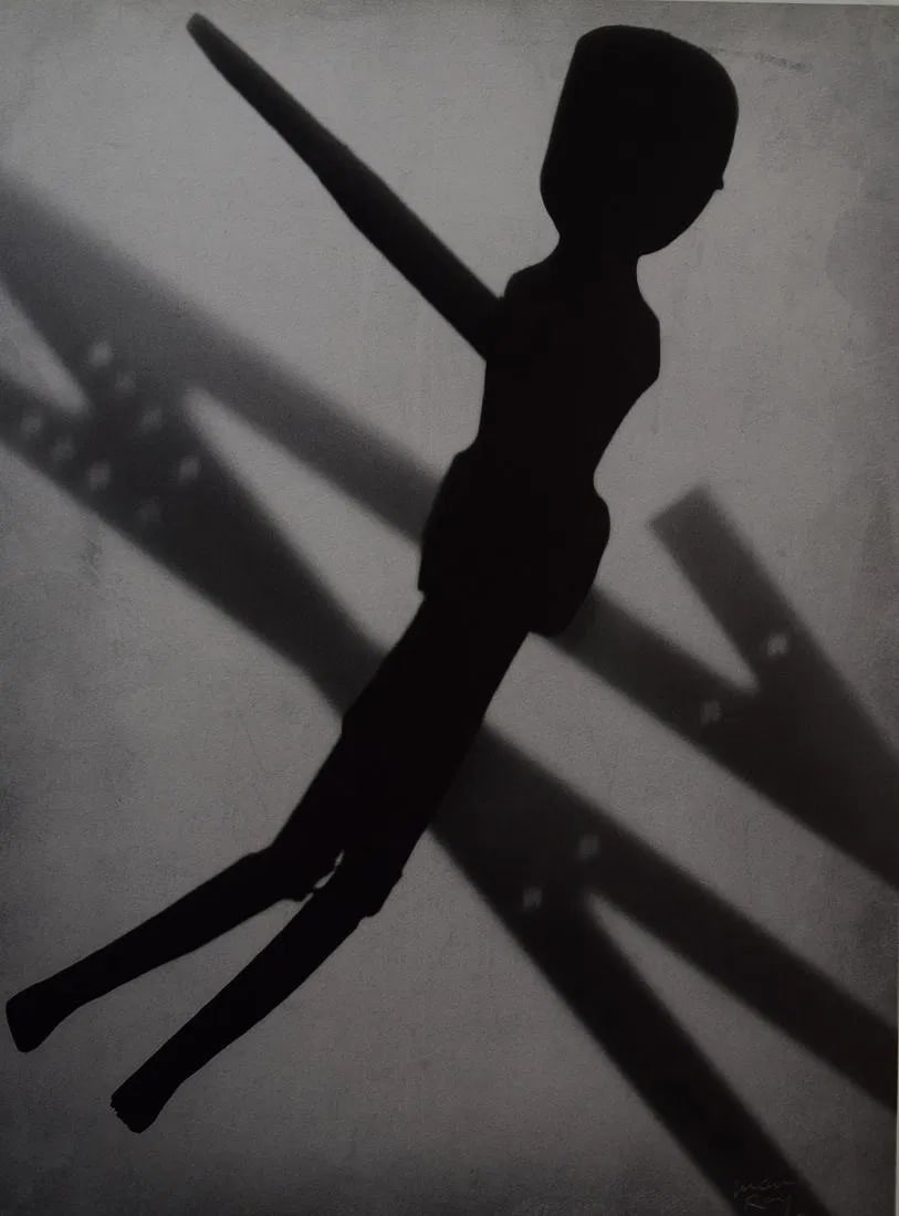 MAN RAY (1890-1976): Rayograph (Mannequin) Printed in colors mounted on archival board 10 3/8" x 7 3/4"