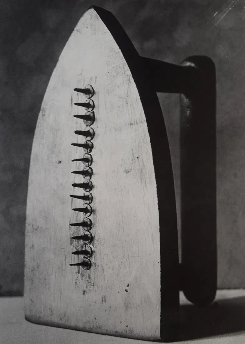 MAN RAY (1890-1976): Cadeau Printed in colors mounted on archival board 10 3/8" x 7 3/4"