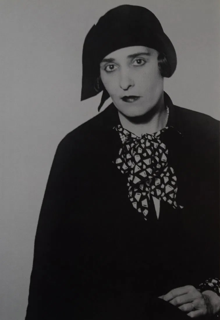 MAN RAY (1890-1976): Black Hat and Costume, Printed in colors mounted on archival board 10 3/8" x 7 1/2"