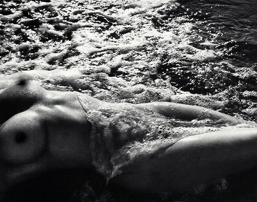 LUCIEN CLERGUE (FRENCH) PRINT ON PAPER: Lucien Clergue (French) Print on Paper. Female Nude Body. Printed in Switzerland in 1968, Published by Pierre Belfond Editions. Measures 11.00 x 9.00 inches.