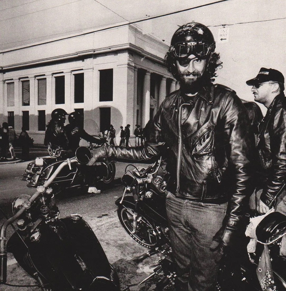 BURK UZZLE (AMERICAN) PRINT ON PAPER: Burk Uzzle (American) Print on Paper. Motorcycle Week, Daytona Beach (1983). Printed in France in 1984. Measures 8.25 x 8.25 inches. Gravure.