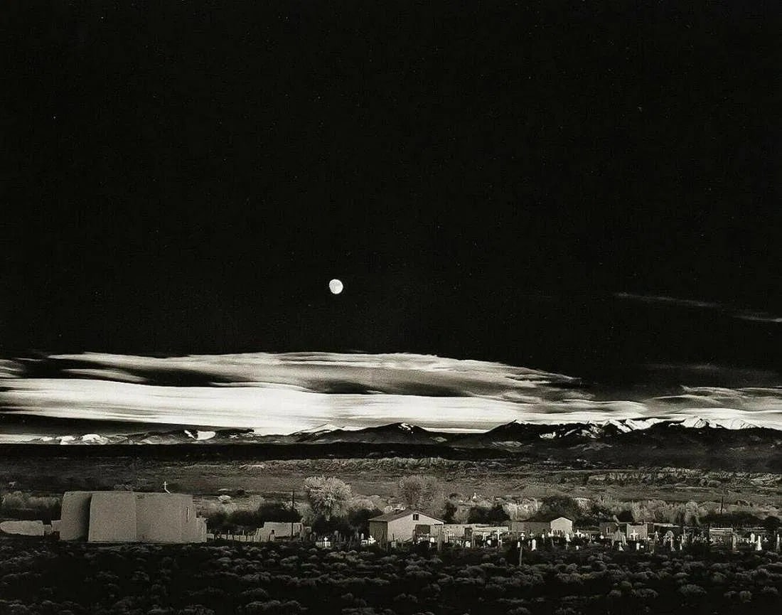ANSEL ADAMS (AMERICAN) PRINT ON PAPER: Ansel Adams (American). Moonrise Hernandez, New Mexico (1944). Printed in USA in 1972 and Published by Rapoport Printing Company. Measures 6.00 x 7.75 inches. Semi-gloss.