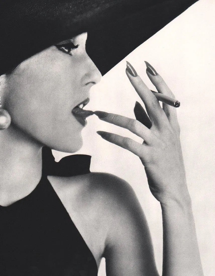IRVING PENN (AMERICAN) PRINT ON PAPER: Irving Penn (American) Print on Paper. Girl with Tobacco. Printed in Switzerland in 1960. Measures 9.00 x 12.00 inches. Gravure.