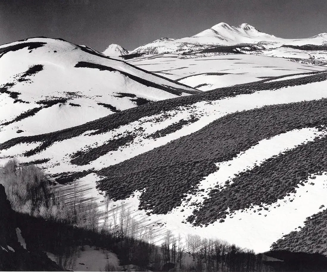 ANSEL ADAMS (AMERICAN) PRINT ON PAPER: Ansel Adams (American). Mountains from Conway Summit, Early Spring, Sierra Nevada (C. 1952). Printed in USA in 1970s. Measures 6.00 x 8.50 inches. Double impression photo-lithograph.